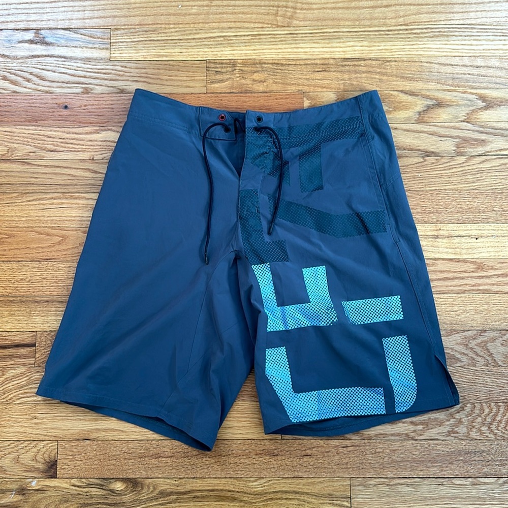 Gray and blue Reebok CrossFit training shorts.